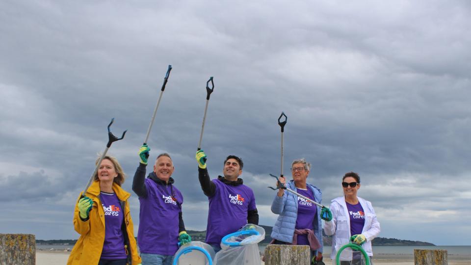 FedEx volunteers cleaning a beach in Ireland